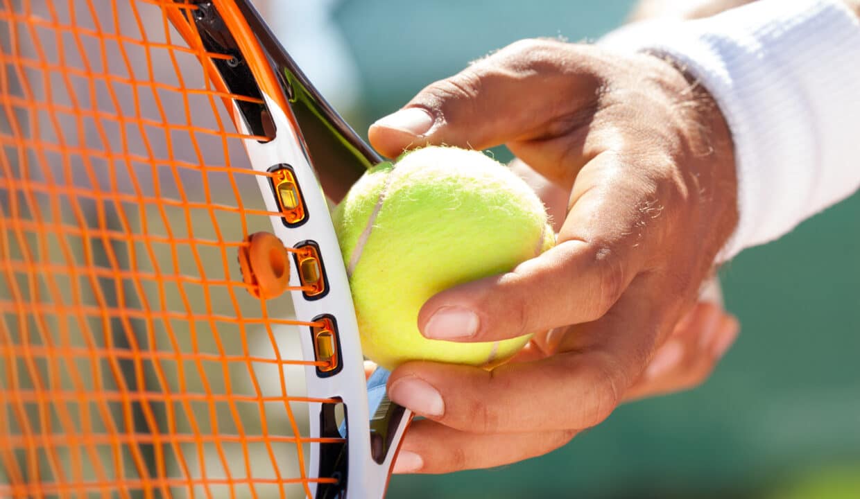 Player's,Hand,With,Tennis,Ball,Preparing,To,Serve